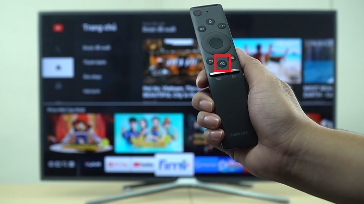 Nhấn nút Home trên remote tivi Samsung.
